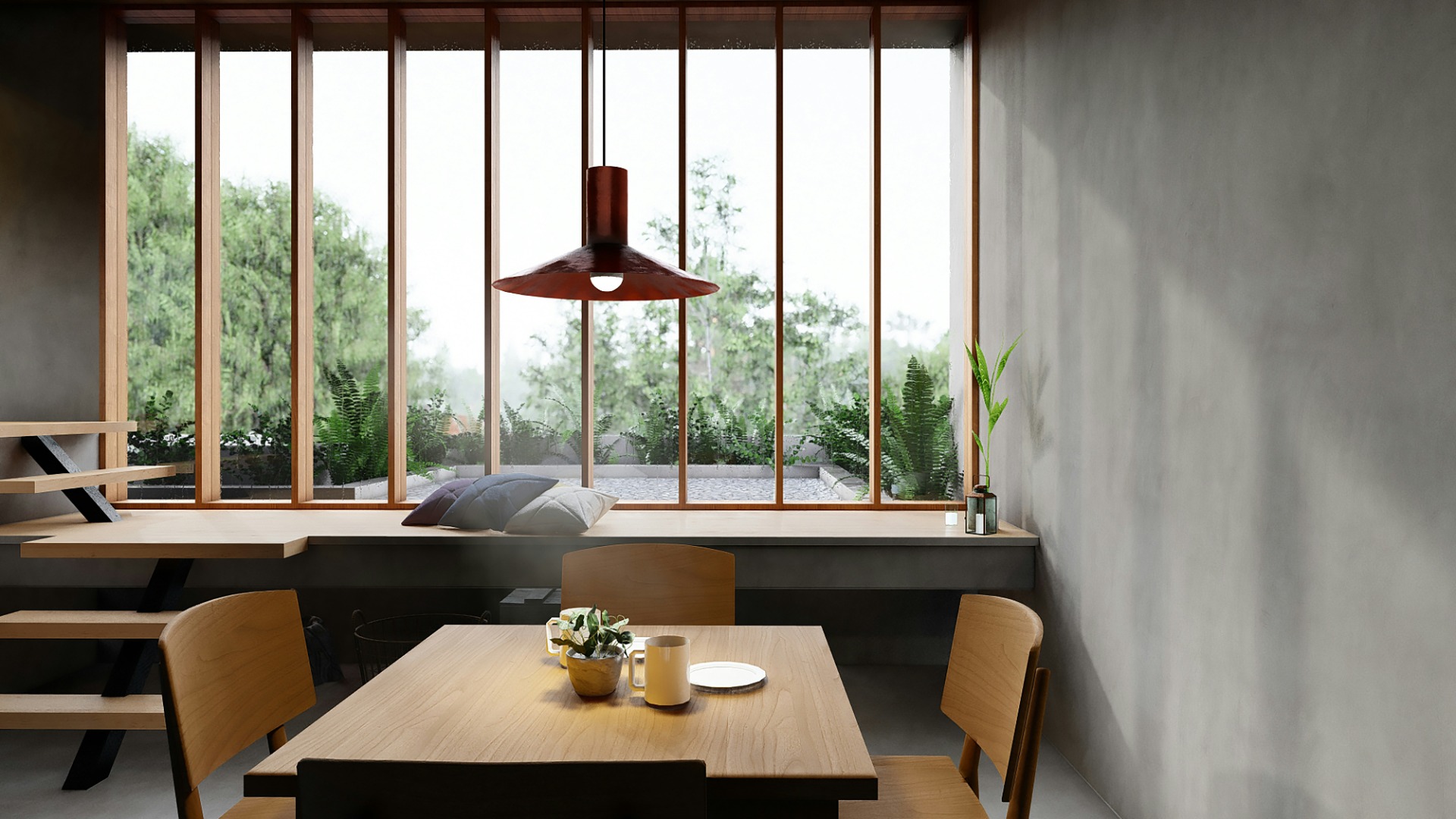 Brown wooden table and chairs surrounded by biophilic elements