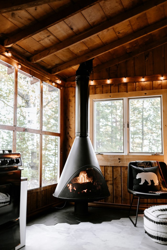 Fireplace in a cosy wooden cabin 