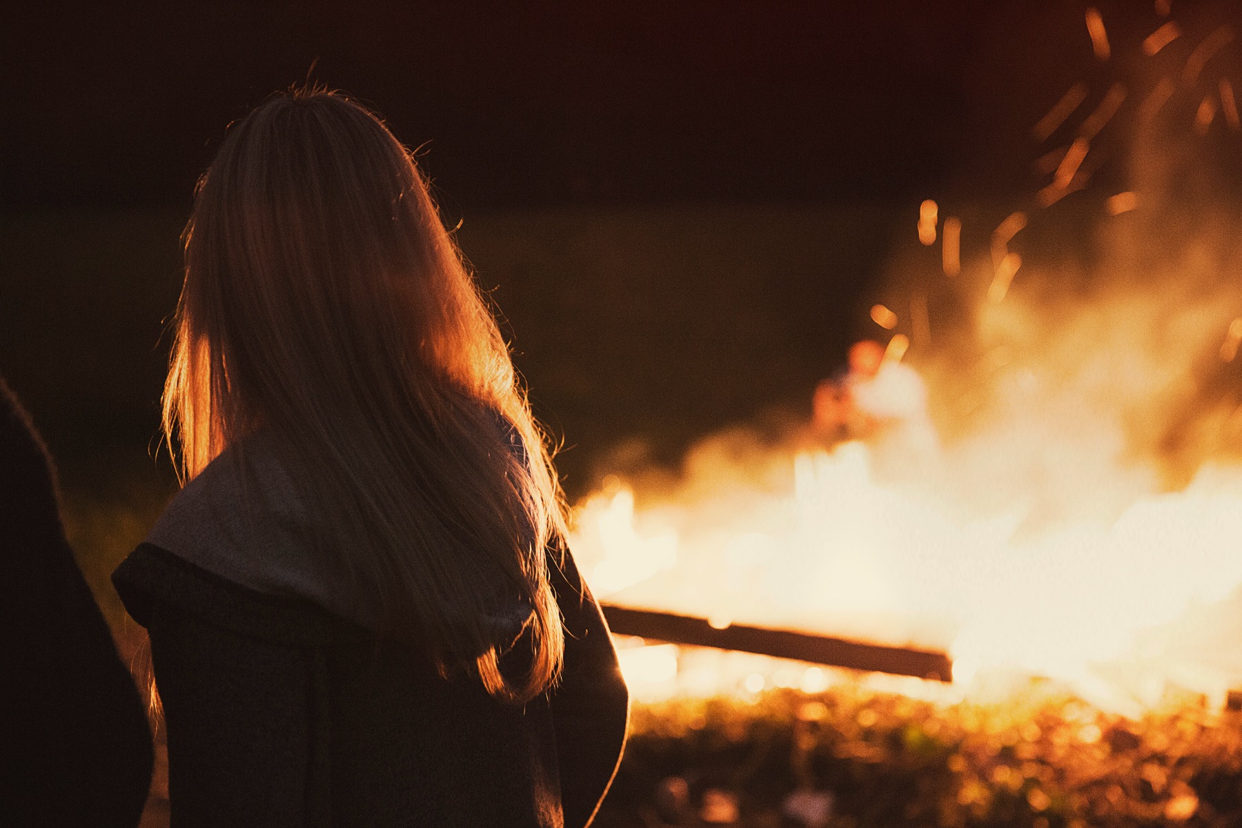 Woman watching a big fire