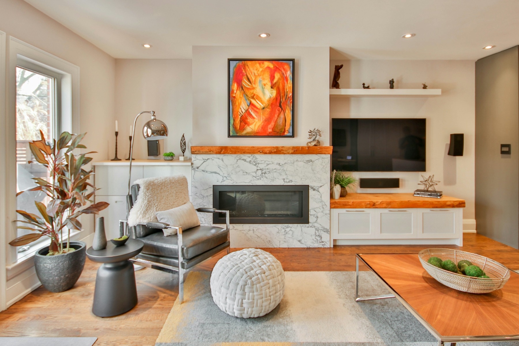 Contemporary living room with modern furniture and fireplace