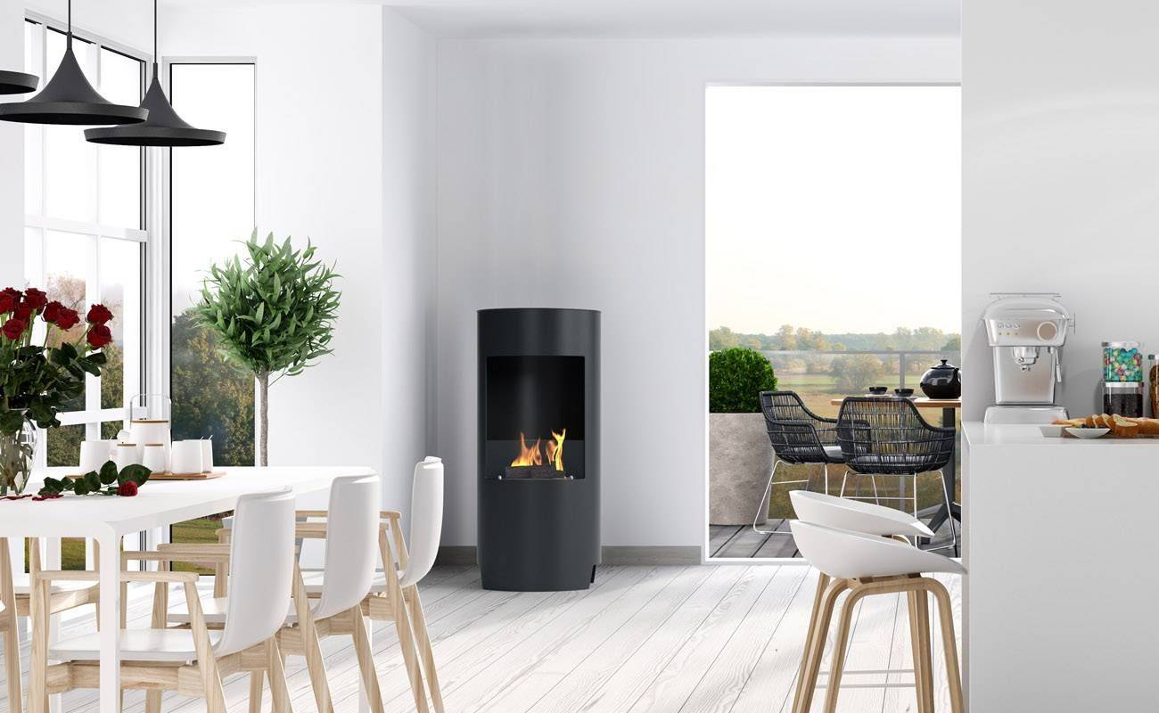 Black bioethanol fireplace in a white kitchen opening to a balcony