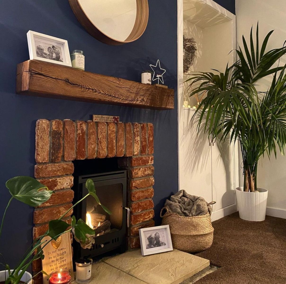 Black bioethanol fireplace inside a brick surround